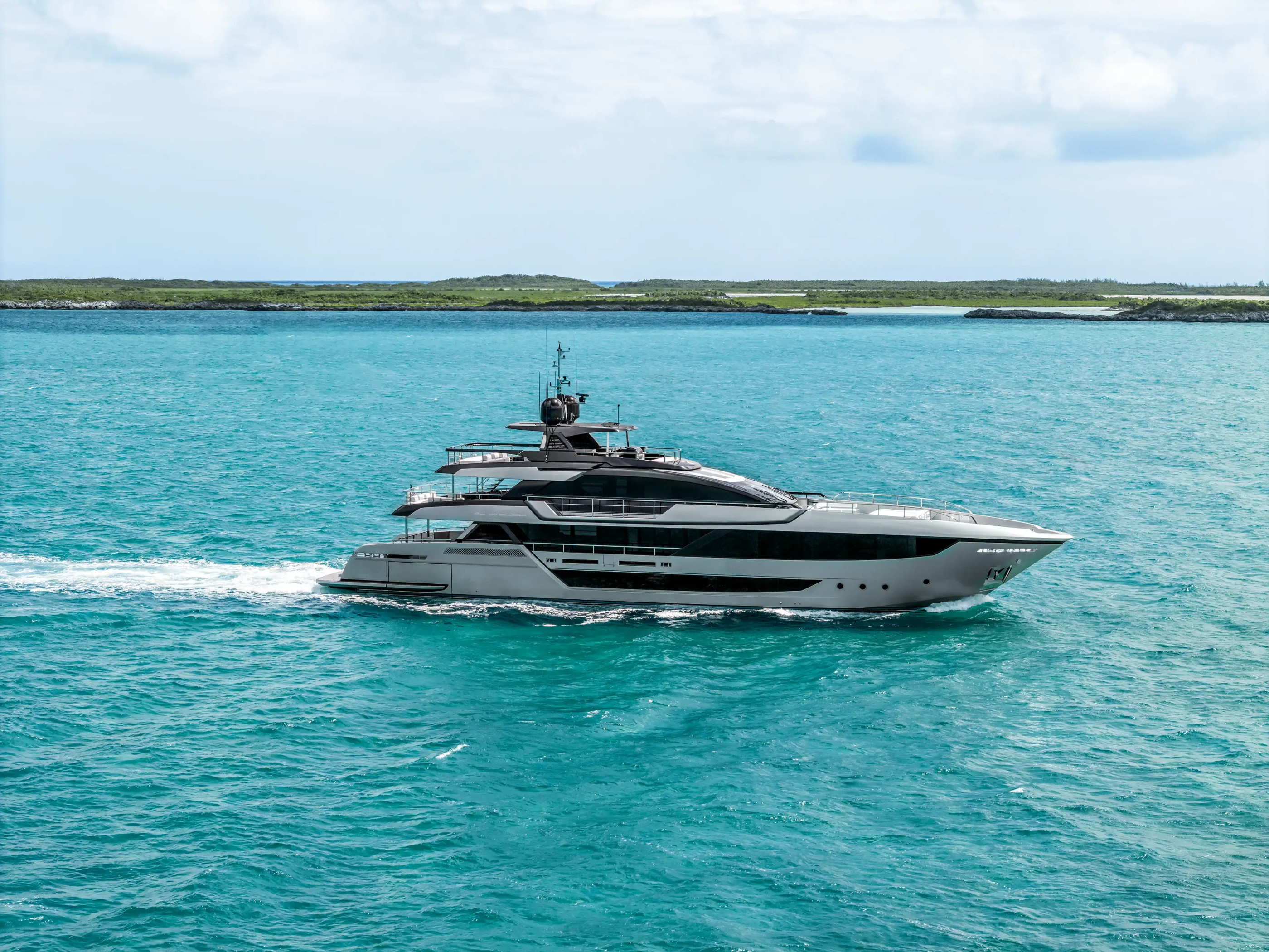 Riva 130 Bellissima underway across turquoise water in official photography.