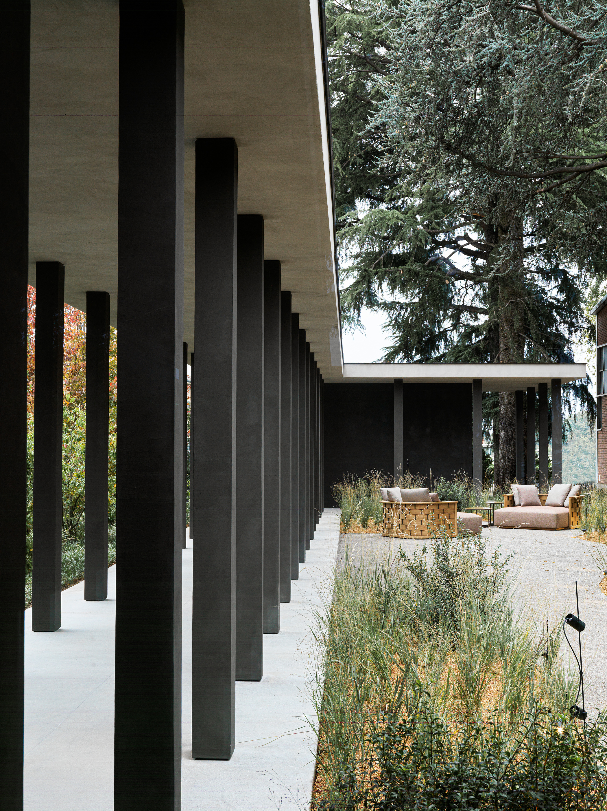 Columns and the covered passage establish a sequence towards the garden.