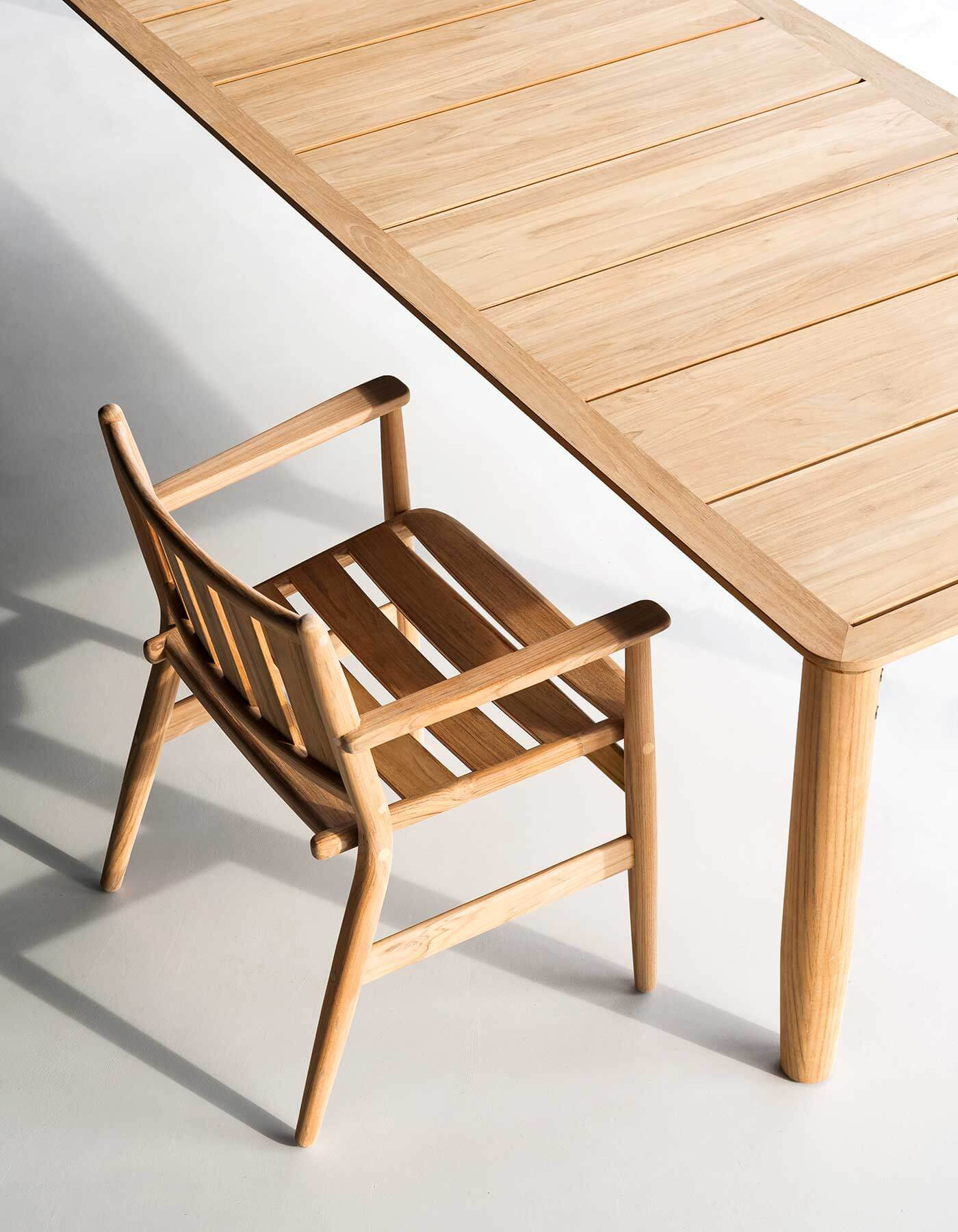 A dining chair and the slatted table seen from above.
