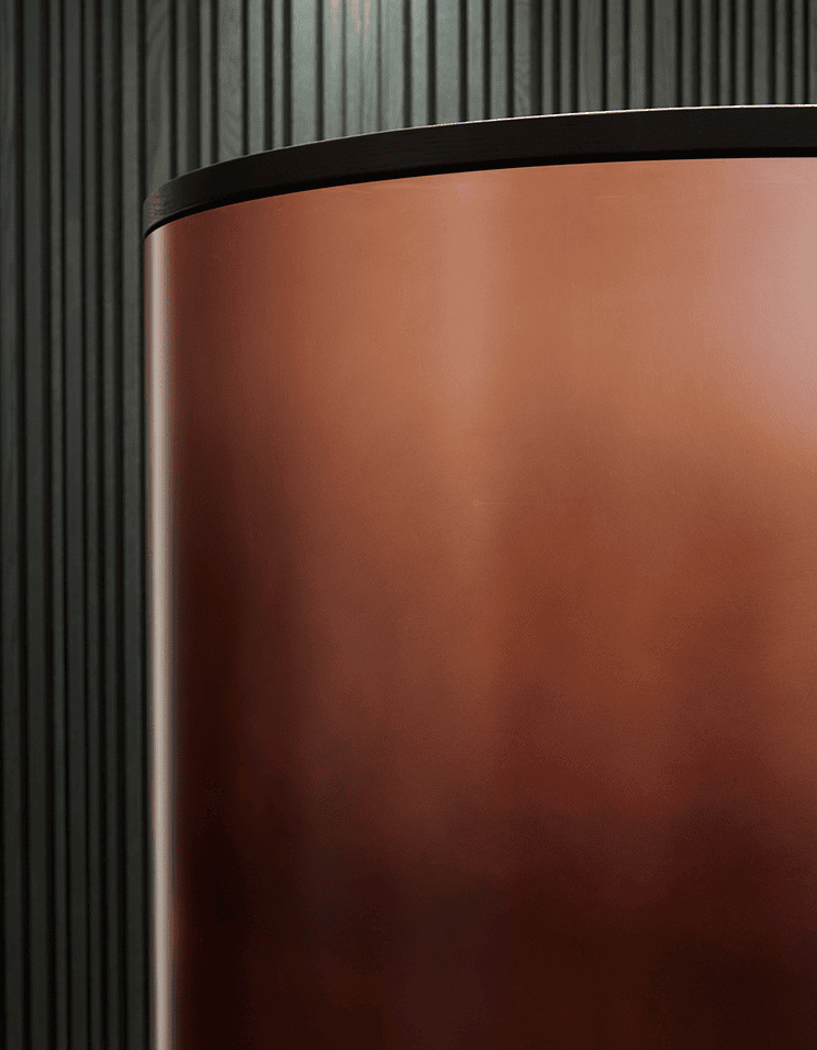 Curved copper application in the Speicherstadt reception project, identified in the official material gallery.