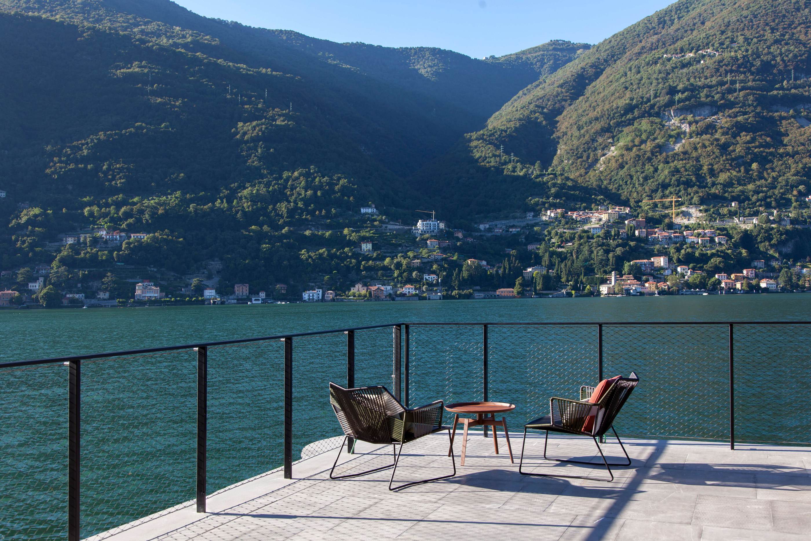 A furnished terrace makes the lake part of an outdoor setting.