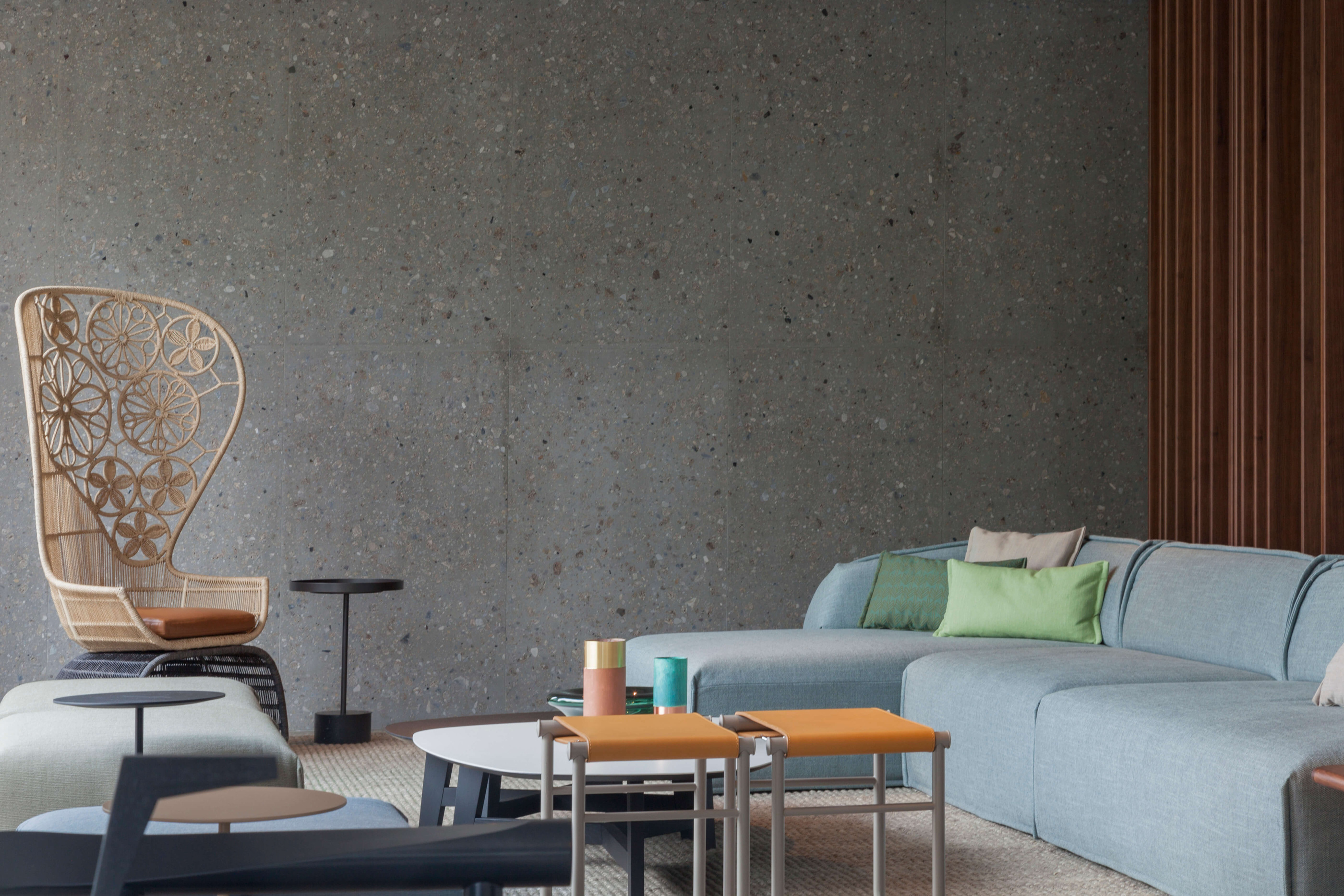 A lounge setting brings textiles, timber and stone into the interior.