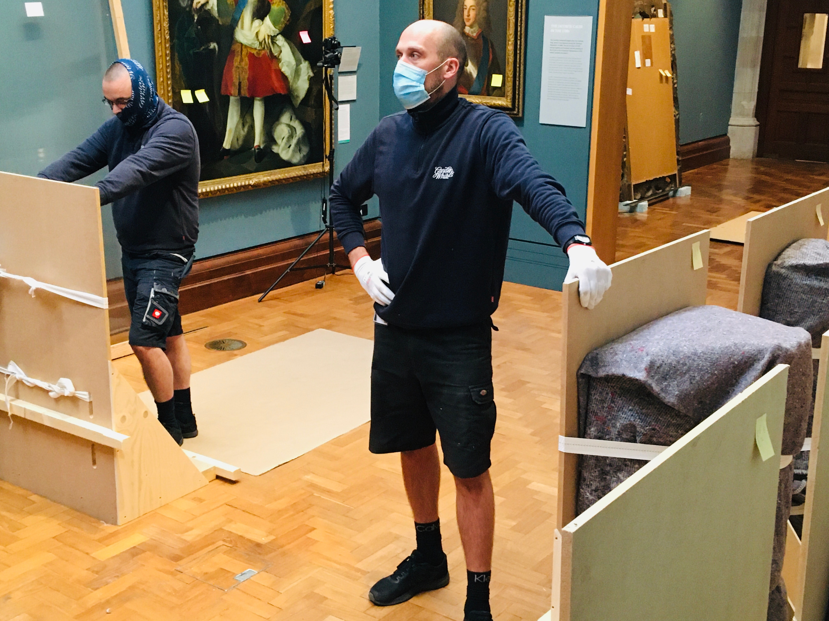 Gander & White published art-handling photograph: a framed work being packed; an illustration of the service context, not a condition examination.