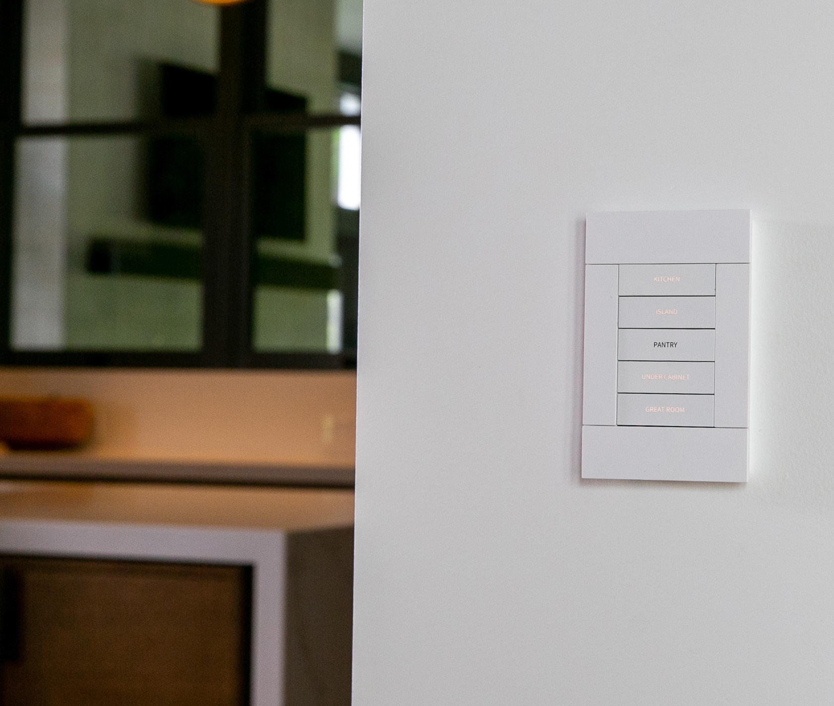 A physical wall control in the Maryland residence, as reproduced in the official Crestron case study.