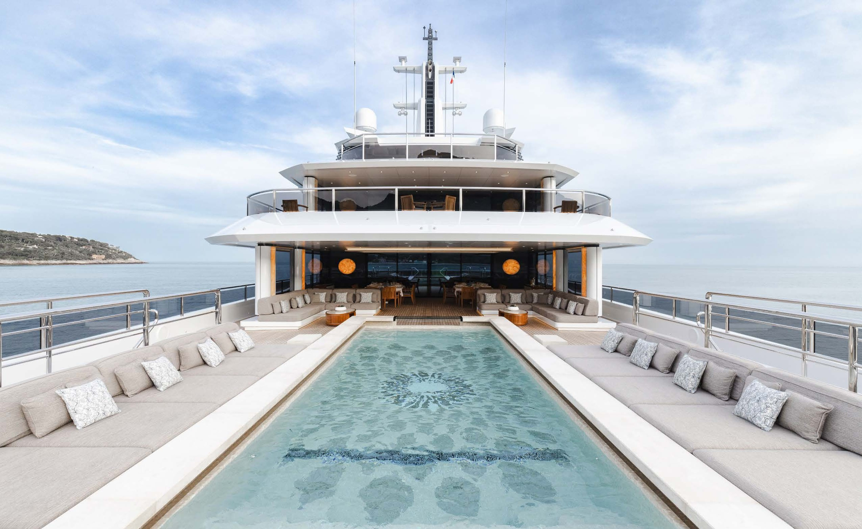 Pool and deck in Burgess’s published yacht imagery; the pictured configuration is illustrative.
