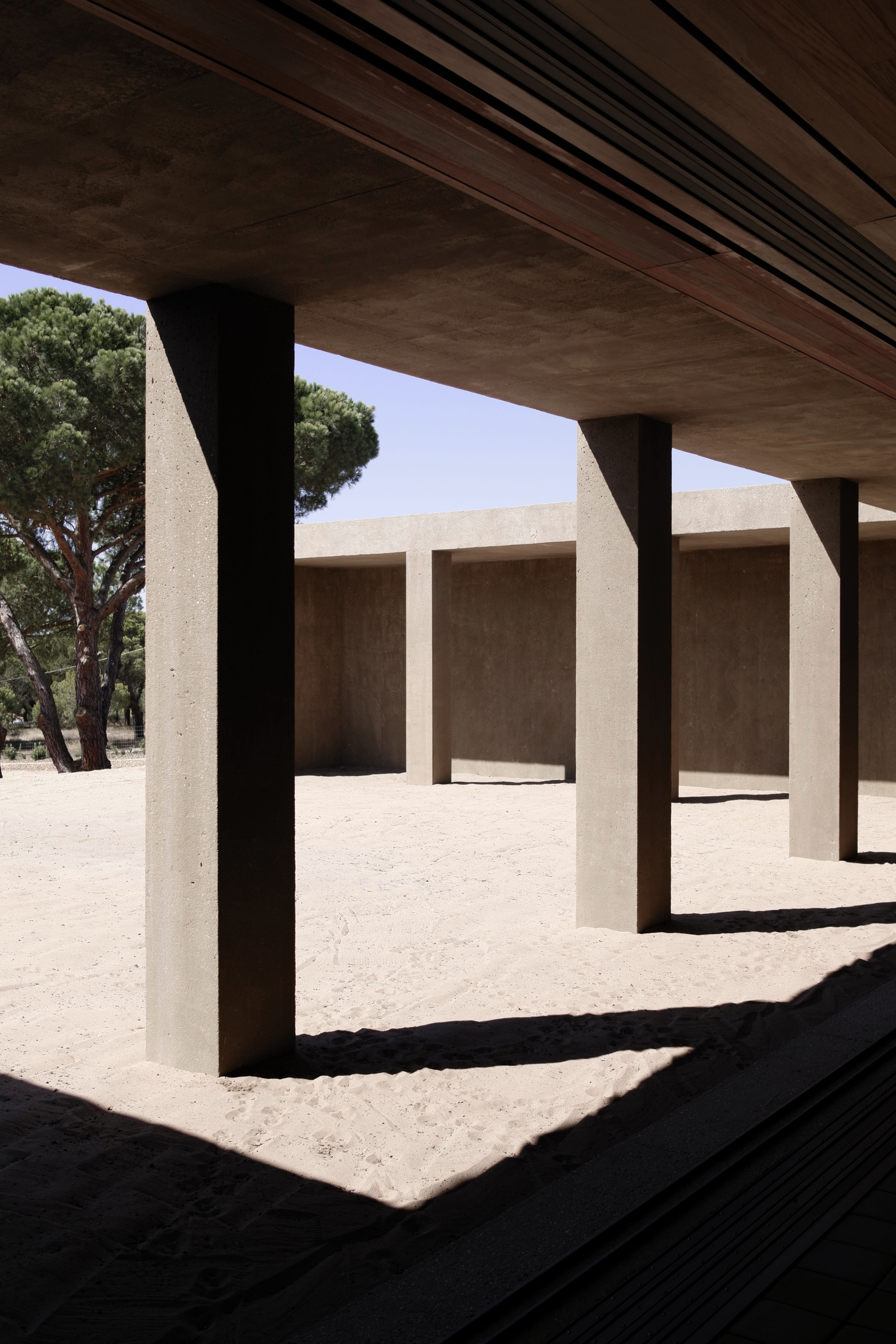 A covered threshold frames the open court.