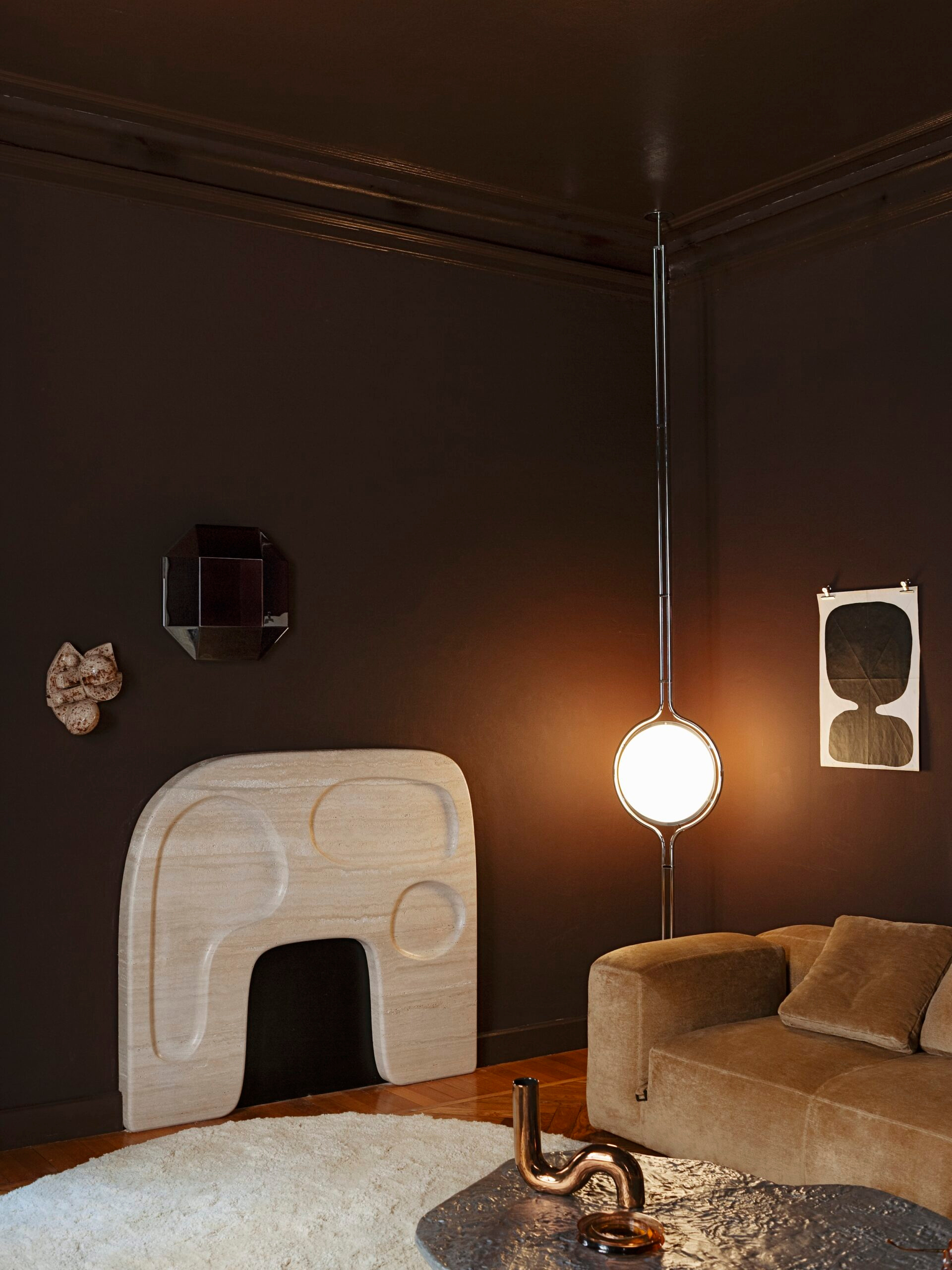 A pendant and hearth establish another point of focus in the interior.