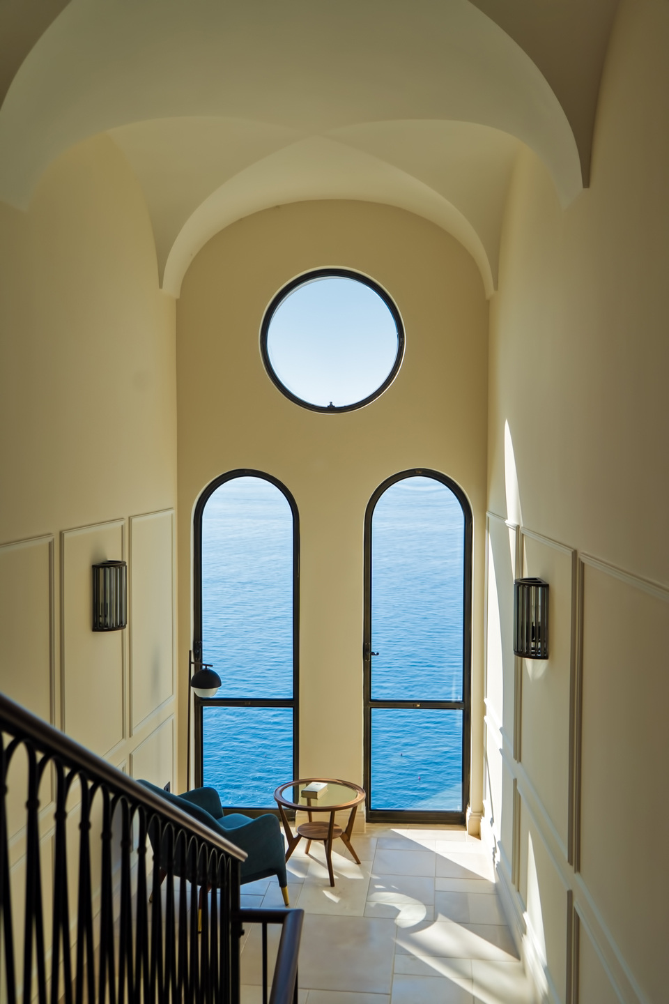 A stair and sea-facing openings in Venicem’s photographic sequence.