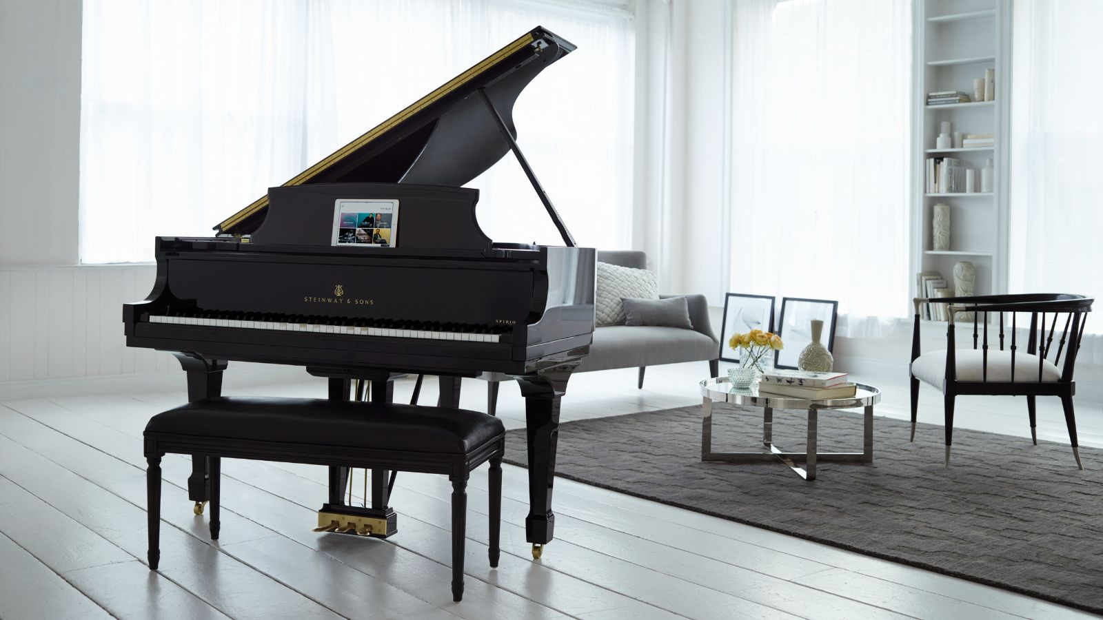 A Steinway Spirio in the manufacturer’s official room setting; a family illustration.
