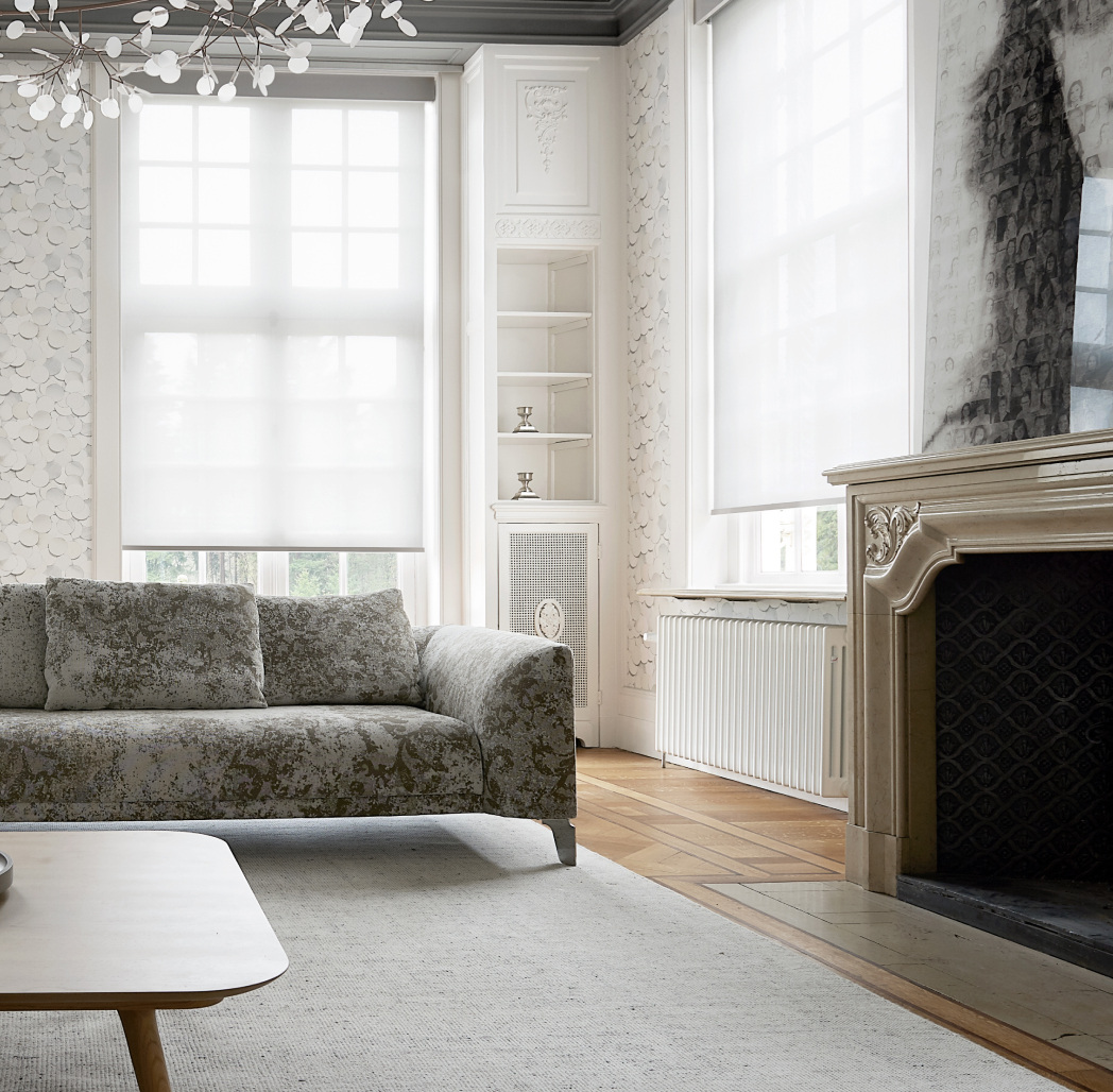 A living-space illustration accompanying Crestron’s shading solutions.