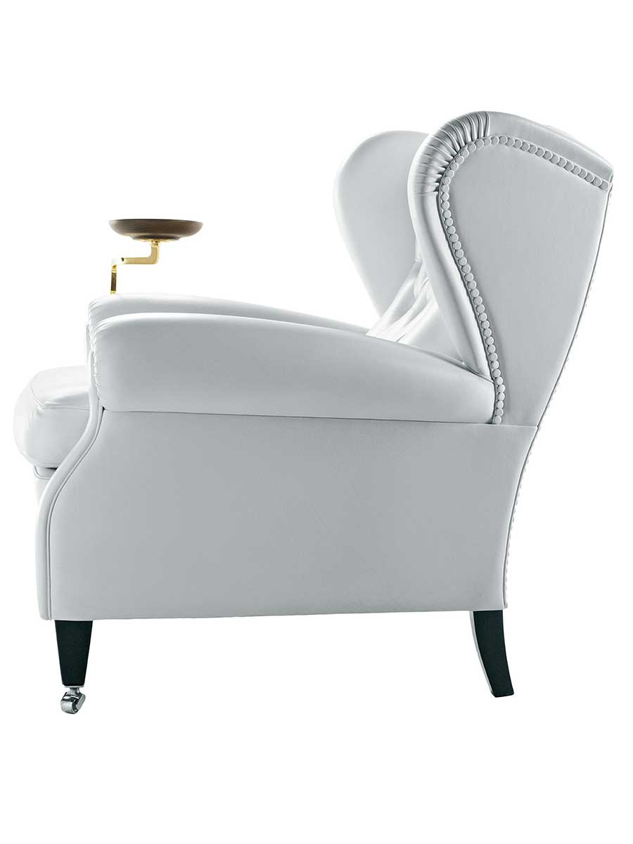 A side studio view of the current 1919 armchair.