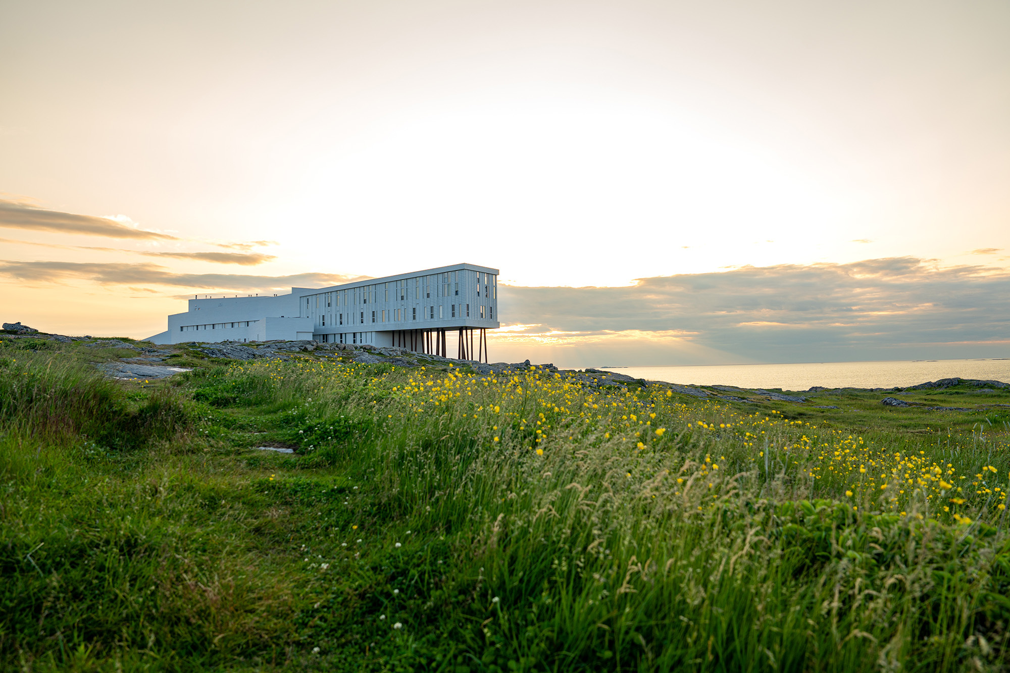 Fogo Island Inn above its Atlantic shore in the property’s official photography.