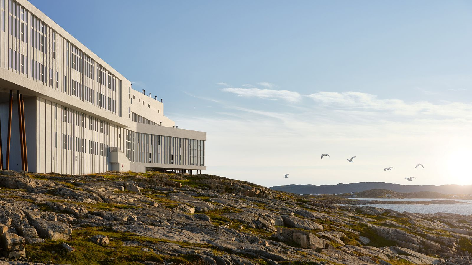 The long waterfront elevation of Fogo Island Inn in official imagery.