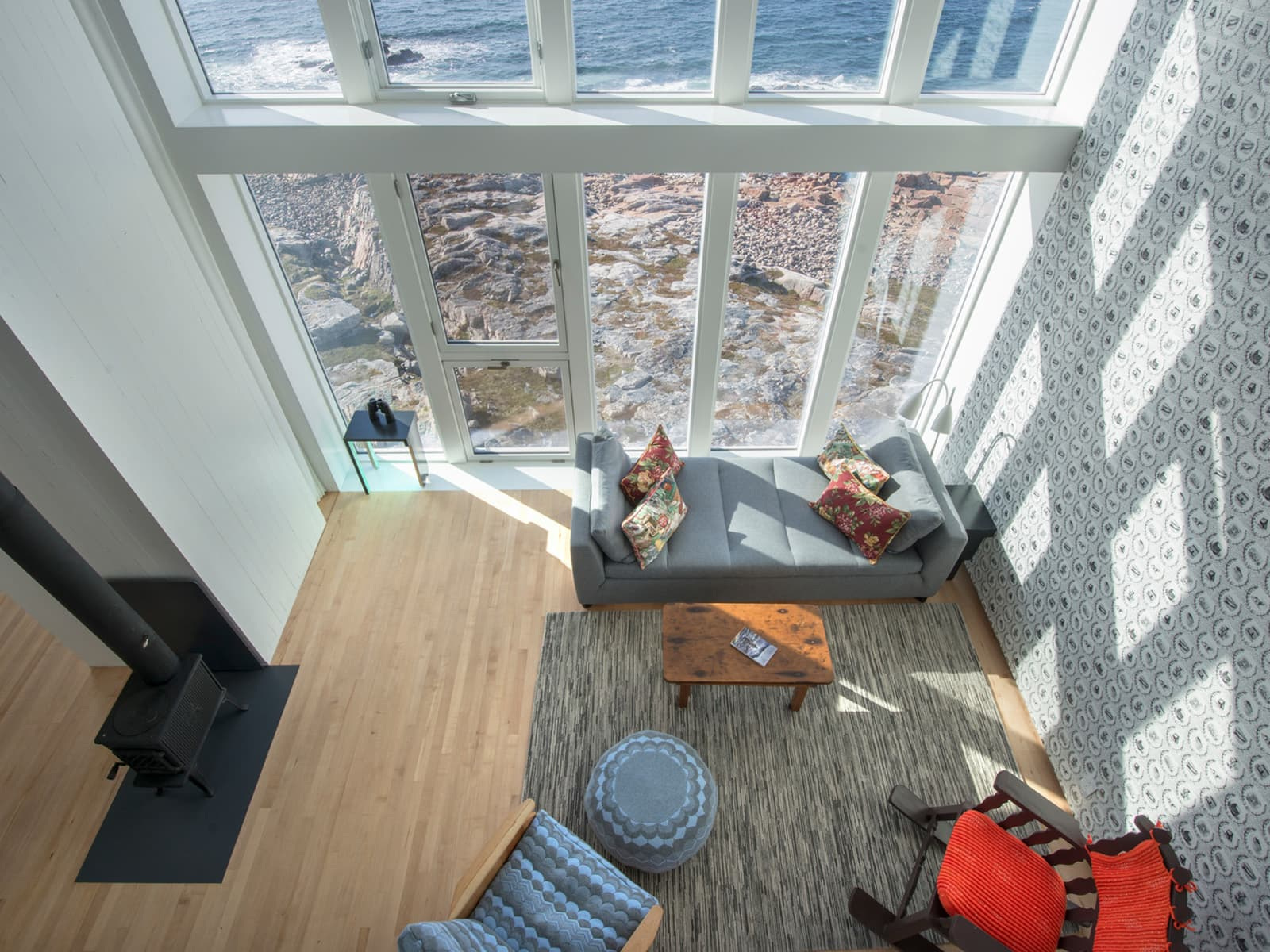 A furnished sitting space beside the windows in the Inn’s published accommodation imagery.