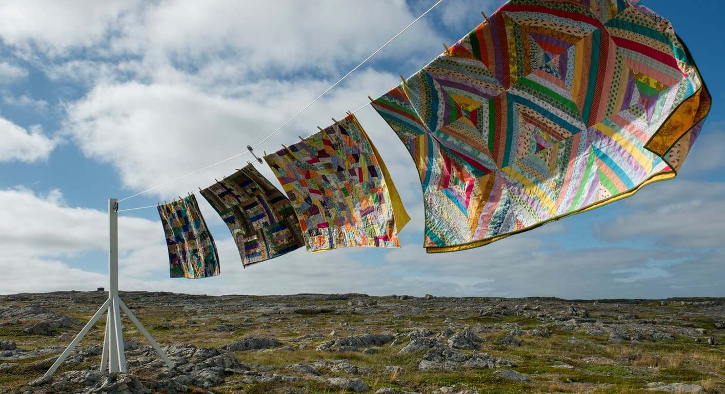 Quilts on a line in the Inn’s official island imagery.