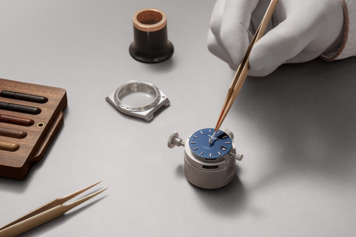 An official assembly image showing the blue dial before the case is fitted.