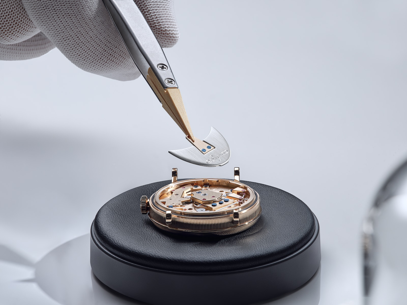 Placement of the winding weight in the manufacturer’s published making sequence.
