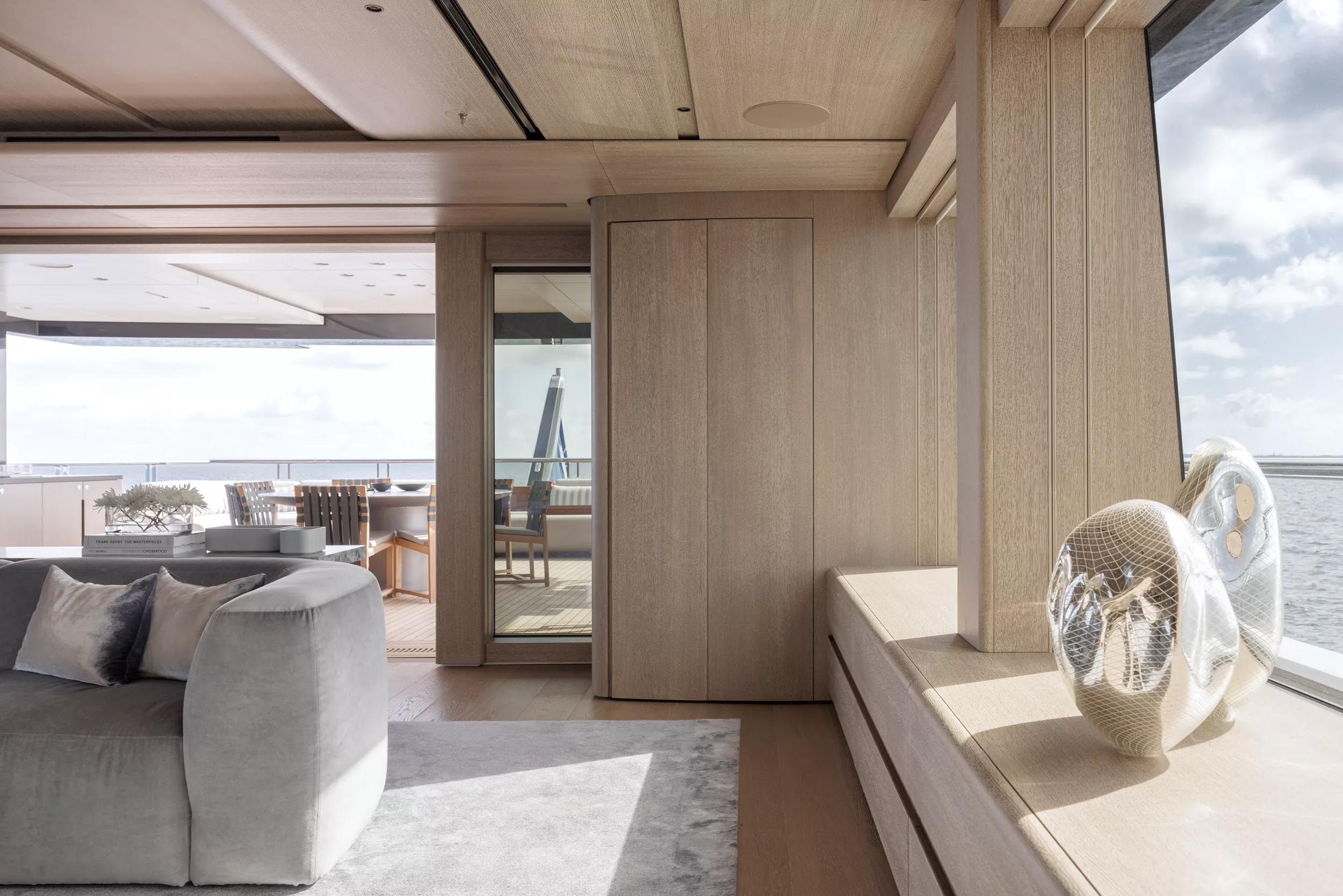 The meeting of joinery, windows and pale furnishings in ENTOURAGE’s main saloon.