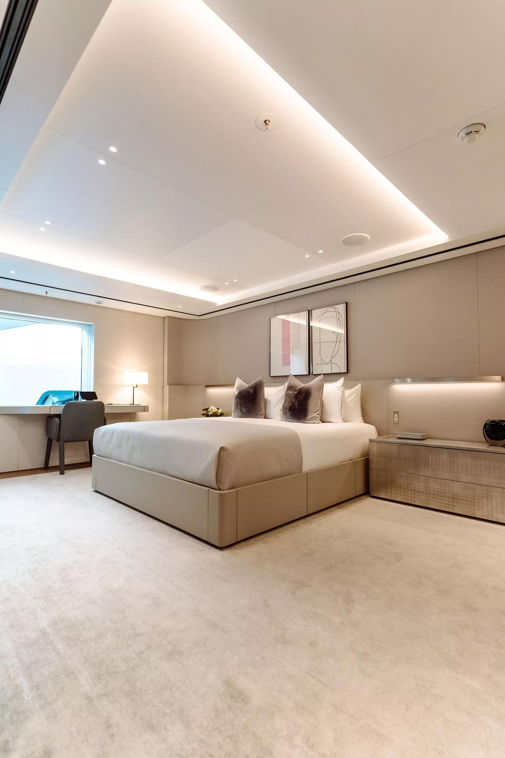 A bedroom view in the official ENTOURAGE gallery, with light finishes and an upholstered bed.