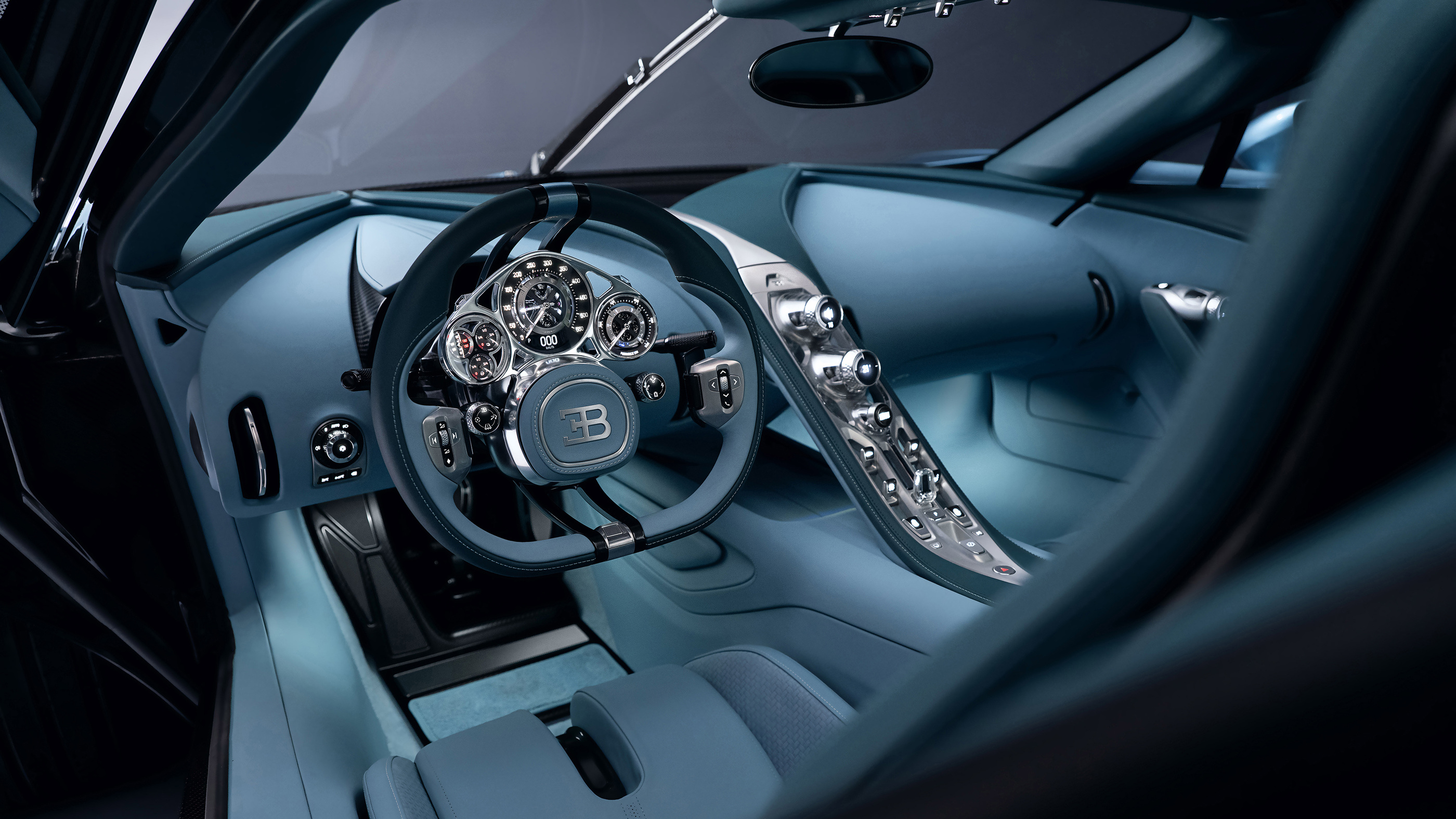 The cabin and physical instrument assembly in Bugatti’s December 2025 interior photographs.