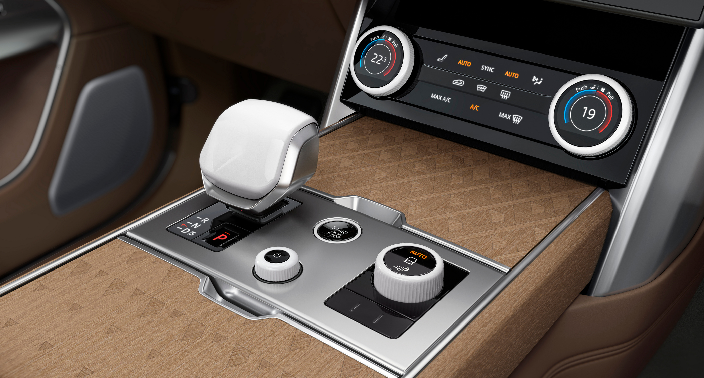 Pale ceramic controls beside wood and metal in the Serenity console.