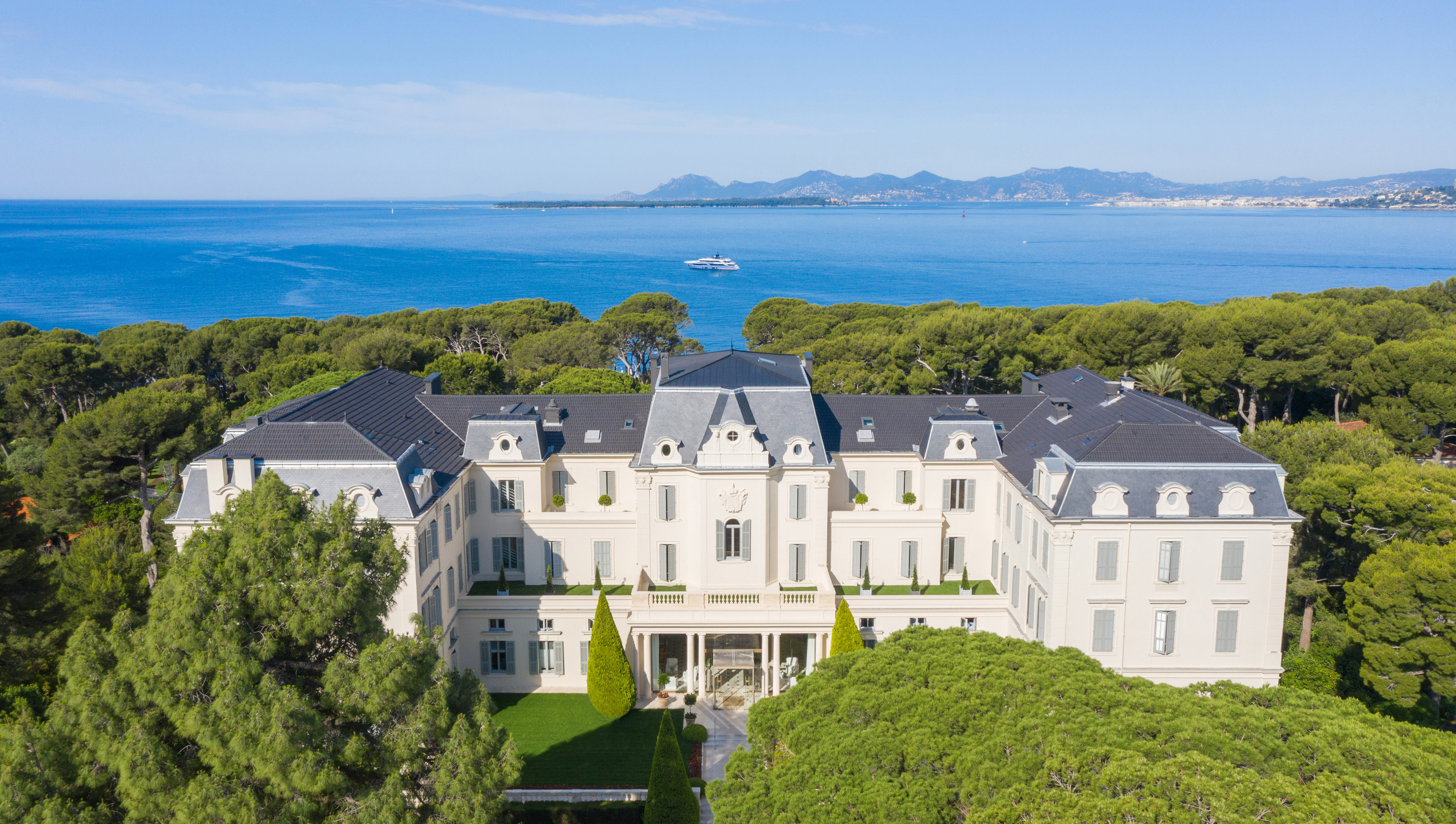 The main hotel building amid the parkland in the official aerial photograph.