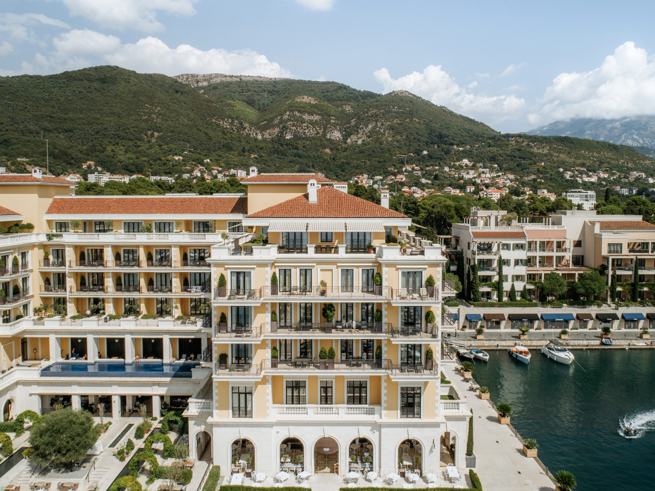The waterfront hotel building labelled The Quince in Porto Montenegro’s current official destination map.