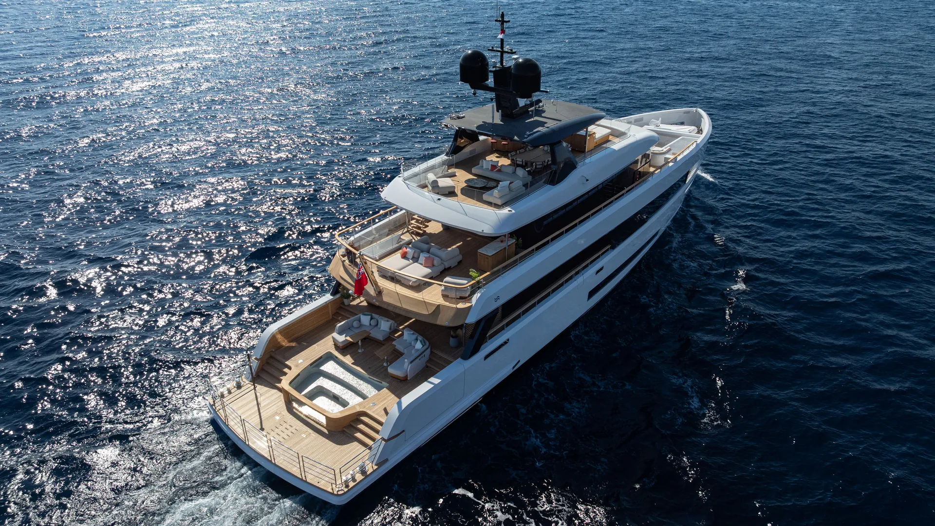Aerial photograph of the Sirena 42M underway, with its decks and stern terraces visible.