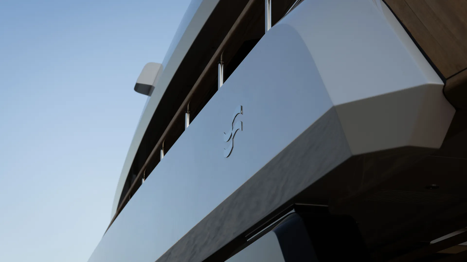 Close view of the Sirena 42M superstructure and Sirena emblem above the hull glazing.