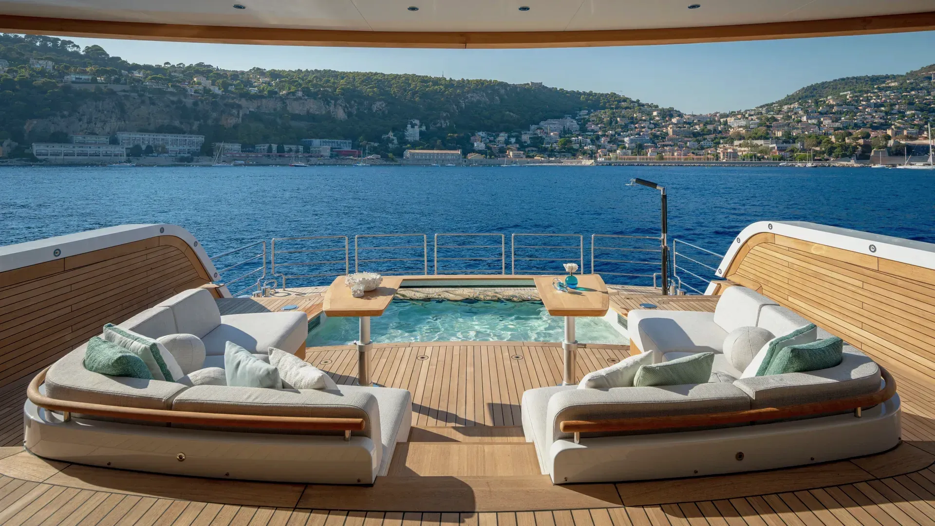 View from the Sirena 42M saloon towards outdoor seating and the aft pool.